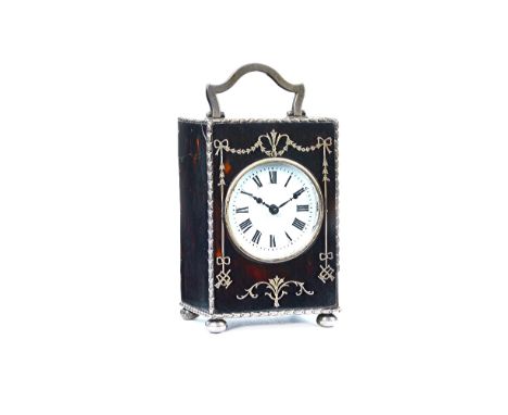 A silver mounted tortoiseshell rectangular cased carriage clock timepiece, the movement detailed to the backplate Made In Fra