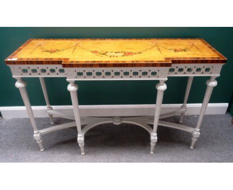 An 18th century style console, the floral painted satinwood break front top on a cream painted base, with six tapering fluted