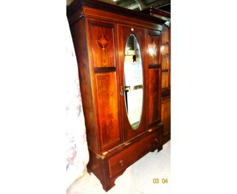 An Edwardian marquetry inlaid mahogany wardrobe, with central mirrored door, on bracket feet, 126cm wide x 195cm high.