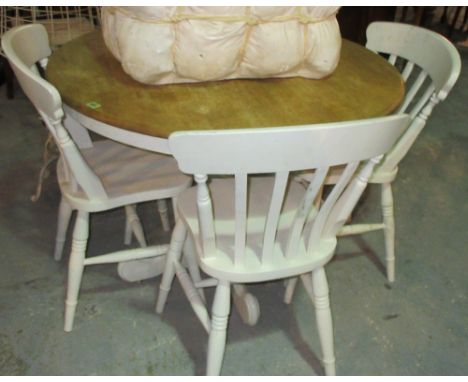 A 20th century circular top hardwood dining table, on white painted quadripartite base, 100cm wide x 78cm high and a set of f