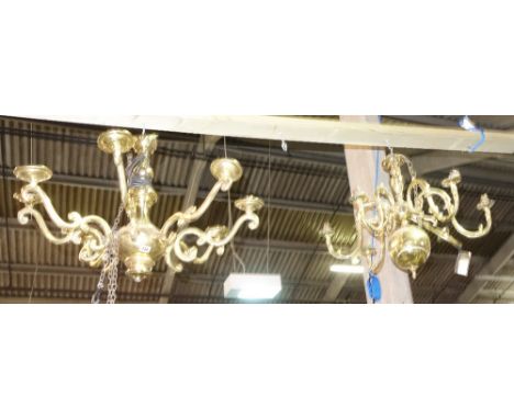 A 20th century gilt brass eight branch chandelier and a similar five branch chandelier, (2). 