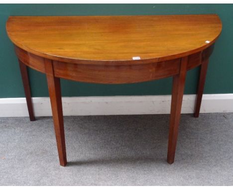 A pair of George III inlaid mahogany semi-elliptic console tables, on tapering square supports, 122cm wide x 71cm high x 62cm
