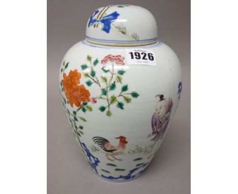 A Chinese famille-rose ovoid vase and cover, painted with a boy with a cockerel amongst flowers, the reverse with calligraphy