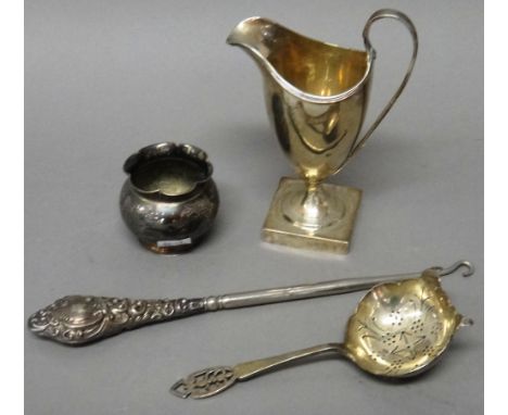 Silver and silver mounted wares, comprising; a George III helmet shaped cream jug, raised on a square foot, maker Peter & Ann