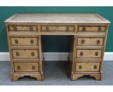 A 19th century scumble painted pine desk, with nine drawers about the knee, 123cm wide x 80cm high x 55cm deep.