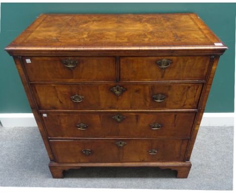 An early 18th century and later figured walnut chest of two short and three long graduated drawers, on bracket feet, 97cm wid