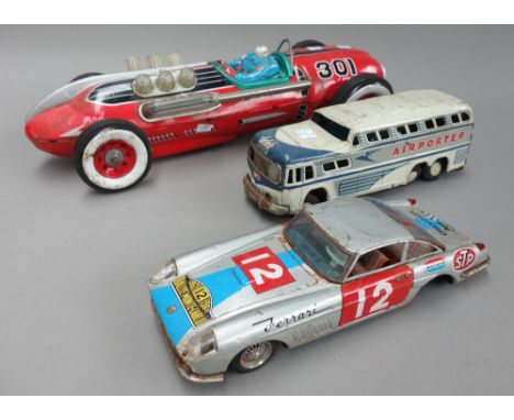 A collection of tin-plate toys, including; a Triang 'Wakouwa', a Silver Arrow aeroplane, boxed, a Japanese 'TM' racing car (4