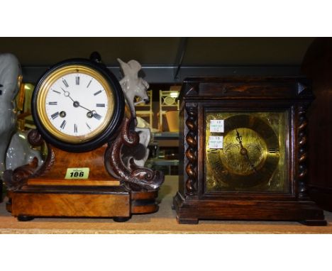 A 20th century small oak mantel clock, (key and pendulum) and a French 19th century walnut mantel clock with dolphin supports