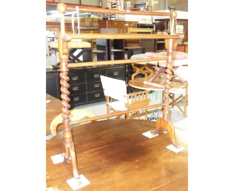 A Victorian mahogany towel rail, with twisted columns on downswept supports, 73cm wide x 69cm high, and a teak and rattan lif