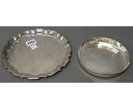 A shaped circular salver, having a pie-crust rim, in the Chippendale style, detailed Silver, diameter 21cm and a circular dis
