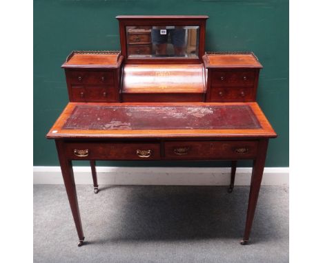 A late 19th century marquetry inlaid mahogany writing desk, with mirrored back fitted superstructure over a pair of frieze dr