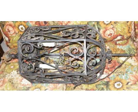 A wrought iron hanging lantern, with scroll decoration, 87cm high, together with a six branch chandelier, 71cm wide, (2).