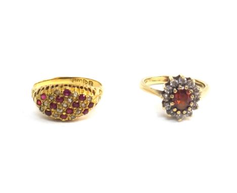 An 18ct gold, ruby and diamond ring, mounted with rows of rubies, alternating with rows of diamonds, in an oval design, Chest