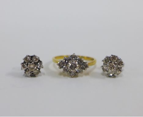 18ct gold diamond cluster ring and a pair of 18ct white gold diamond flower head cluster earrings (2) 