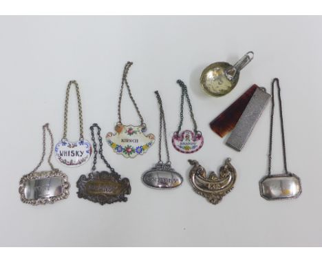 Collection of eight decanter labels to include silver, enamel and Epns examples, an Epns caddy spoon and a white metal and to