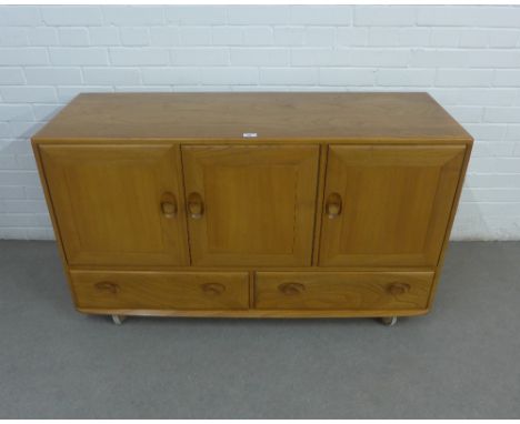 Ercol light elm Model 486 sideboard, with three cupboard doors over two long drawers, 130 x 76 x 46cm 