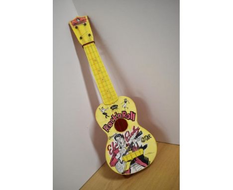 A vintage novelty plastic toy guitar, being Elvis Presley Gitar by Selcol