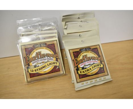 Eleven sets of Ernie Ball Earthwood acoustic strings, 7 x 2006 Extra Light (10s) and 4 x 2010 12 String Light (9s) - please n