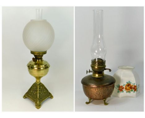 OIL LAMPS ETC. A brass oil lamp with cast base & opaque glass shade, height 57.5cm. Also, an Arts & Crafts hammered copper oi