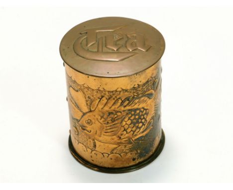 NEWLYN COPPER. A Newlyn copper tea caddy, embossed with two fish amongst seaweed. Stamped 'NEWLYN'. Height 10cm.Please note t