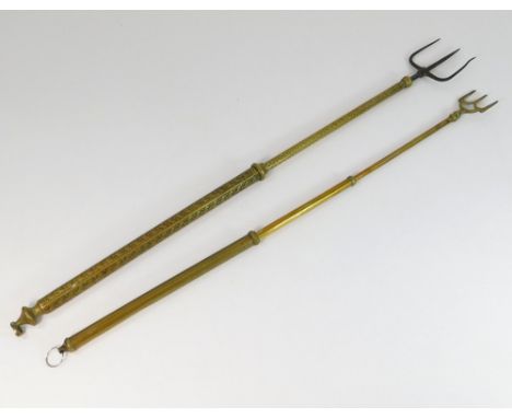 TOASTING FORKS. A 19th century brass & iron retractable toasting fork. Closed length 39cm. Also, one other later retractable 
