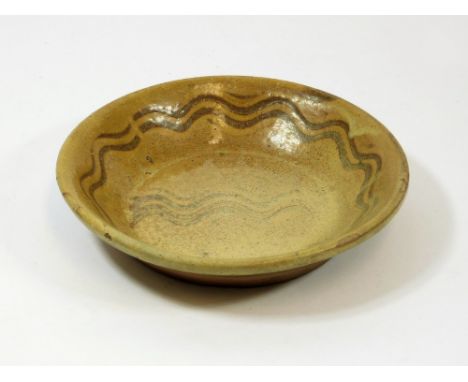 LEACH SLIPWARE?. A slipware bowl, possibly early Leach Pottery?. Unmarked. Diameter 21cm. Provenance: Given to the (St.Ives) 