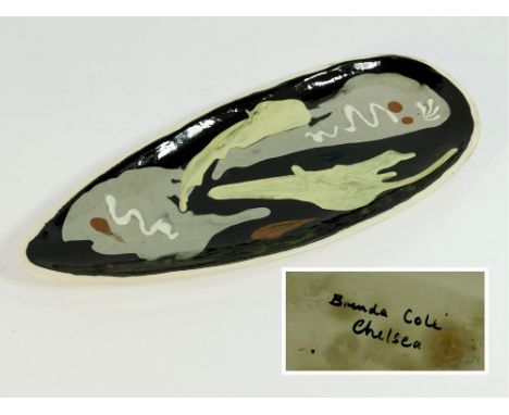 BRENDA COLE. A slip decorated, press moulded dish by Brenda Cole. Length 33cm. Signed 'Brenda Cole Chelsea' to reverse. Note: