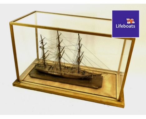 SHIP MODEL. A three masted model Schooner in glazed case. Case size: Height 41cm, Width 65.5, Depth 32.5cm.  Please note that