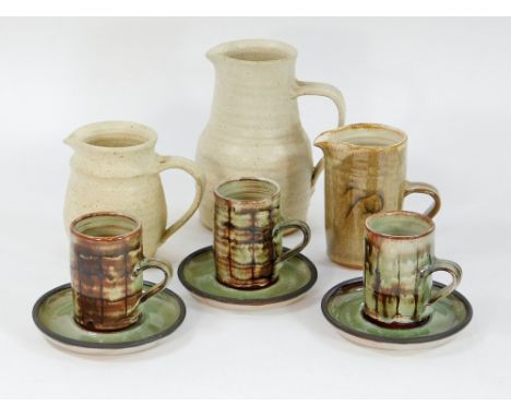 NEWLYN HARBOUR POTTERY. Three Dennis Lane, Newlyn Harbour Pottery jugs, tallest 18cm. & three coffee cups & saucers.  Please 