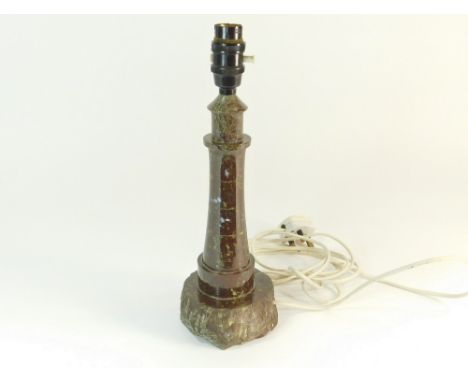 CORNISH SERPENTINE. A turned Cornish serpentine lighthouse table lamp. Height, including fitting 33cm.  Please note that all 