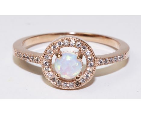 Rose gold plated opal halo ring   Condition Report   Click here for further images, condition, auction times & delivery costs