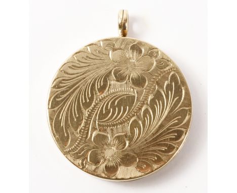 Gold circular locket pendant, bright cut floral decoration hallmarked 9ct approx 11.3gm   Condition Report   Click here for f