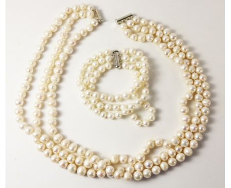 Three strand freshwater pearl necklace and matching bracelet   Condition Report   Click here for further images, condition, a