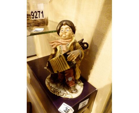 Royal Worcester figurine of street accordian player