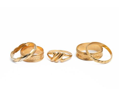 Four Portuguese 19k yellow gold rings of various designs, ring sizes U, V, P and N; and another unmarked assessed as approxim