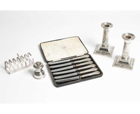 A pair of Victorian silver desk candlesticks William Hutton &amp; Sons Ltd., London 1899, of column form, weighted, 14cm high