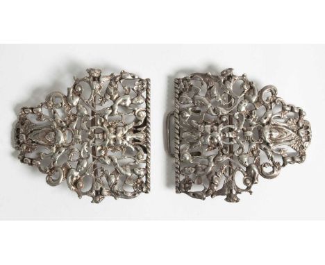A Victorian silver nurses buckle William Comyns, London 1893, of pierced form decorated with satyr masks and mythical beasts,