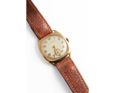 A Cyma wristwatch on a leather strap, engraved to the reverse 'To Mr E Denison with best wishes from the Directors &amp; Staf