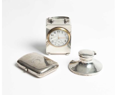 An Edwardian silver cased bedside clock, Chester 1908, with loop handle, the white enamel dial with Arabic numerals and subsi