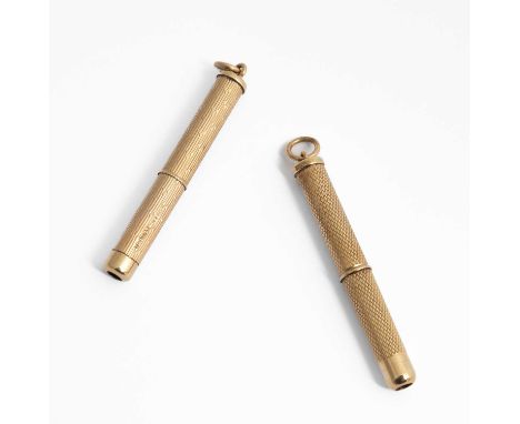 Two 9ct gold propelling toothpicks, each with engine-turned decoration, approximately 12.8g