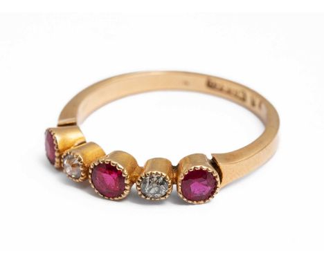 An 18ct yellow gold ruby and diamond five stone ring, set with old cut diamonds and round cut rubies, ring size Q½, stamped '