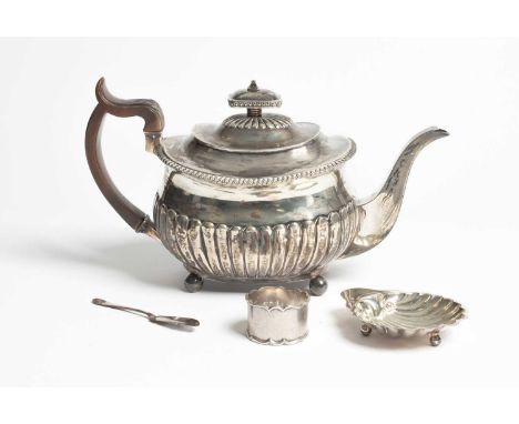 A George III silver teapot, WE, London 1810, of oblong half-ribbed form with carved fruitwood handle, 29cm long, a butter she