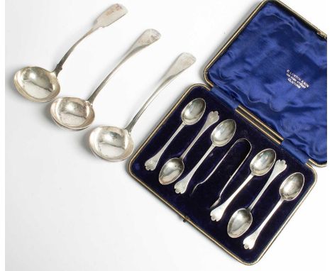A set of six Edwardian silver teaspoons and the matching tongs, JS, Sheffield 1908, cased, a pair of sauce ladles, Goldsmiths