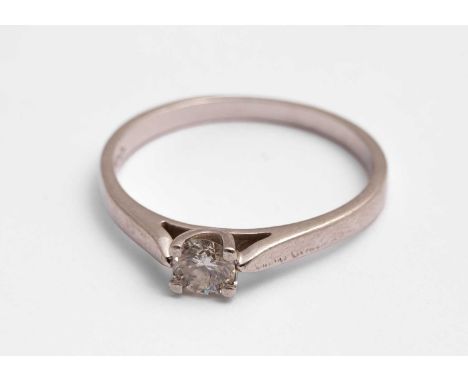 A platinum and diamond solitaire ring, the round brilliant cut diamond approximately 4mm in diameter, estimated diamond weigh