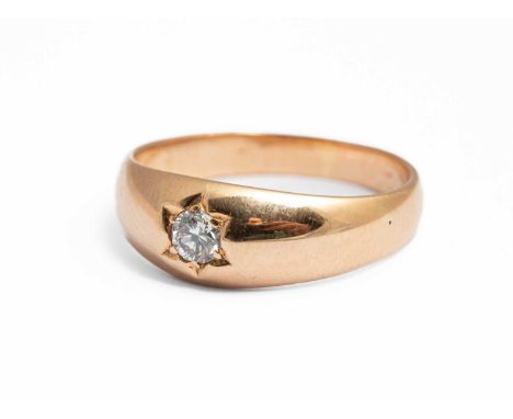 A yellow metal and diamond single stone ring, the round brilliant cut diamond approximately 0.10ct, in a star setting, ring s