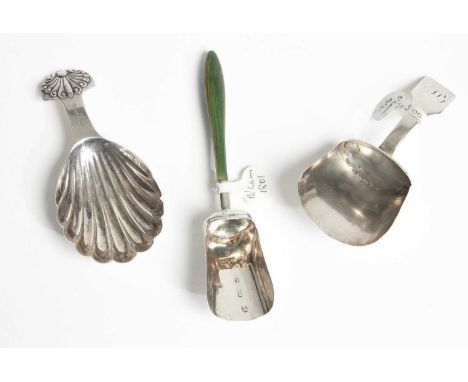 Three silver caddy spoons, two Birmingham 1801 and 1812, one with horn handle and one shell-shaped (3)