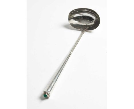 An Arts &amp; Crafts silver ladle, Guild of Handicraft, London 1990, the tapering handle with green cabochon, 31cm long appro