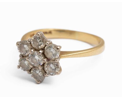 An 18ct yellow gold and diamond seven stone cluster ring, set with round brilliant cut diamonds, estimated total diamond weig