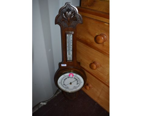 A late 19th/early 20th Century oak cased barometer