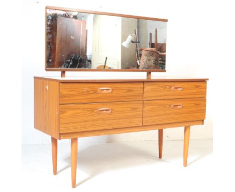 A retro vintage mid 20th century veneered mirror back dressing table / dressing chest of drawers. Rectangular form with an ar